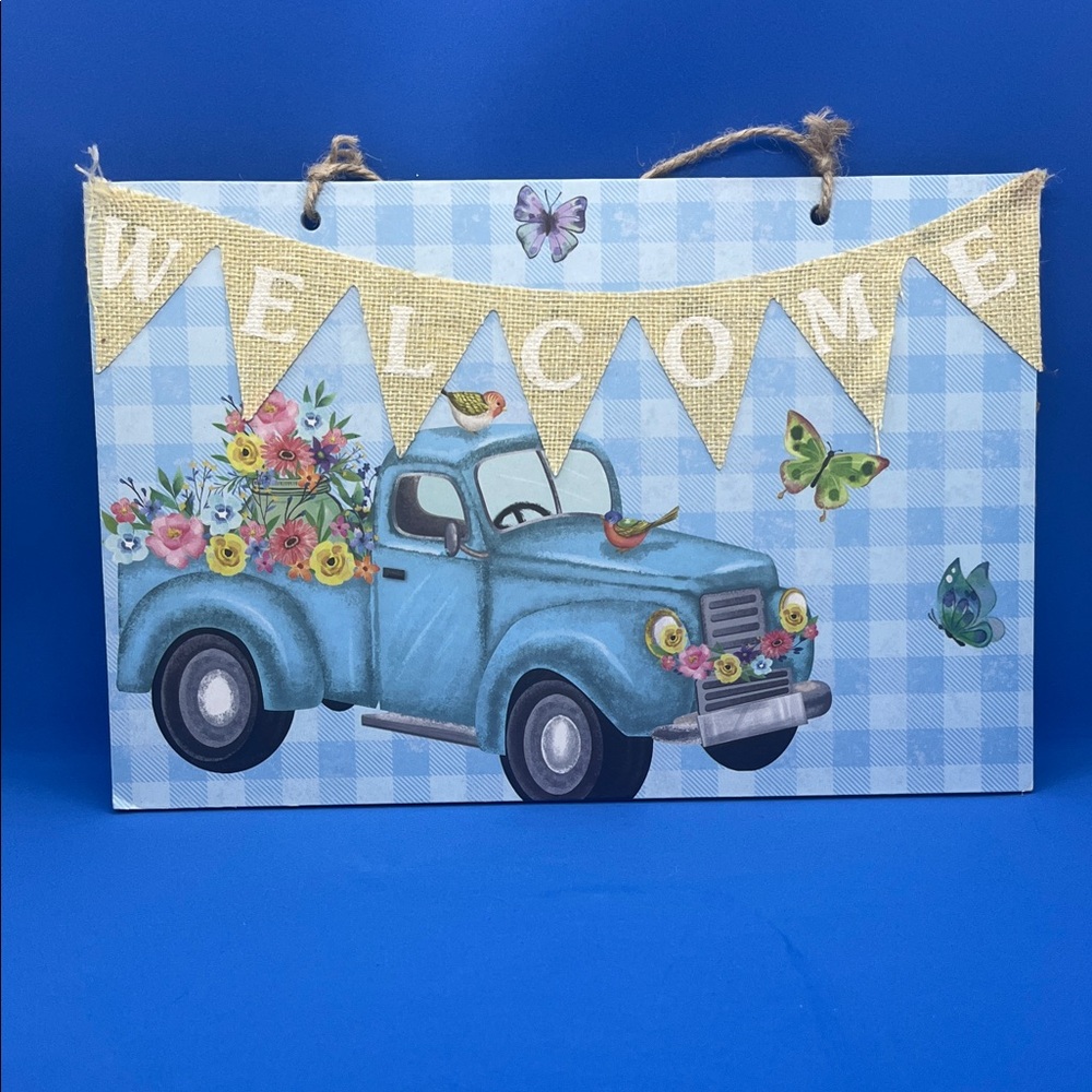 Blue Welcome Sign with Truck Design